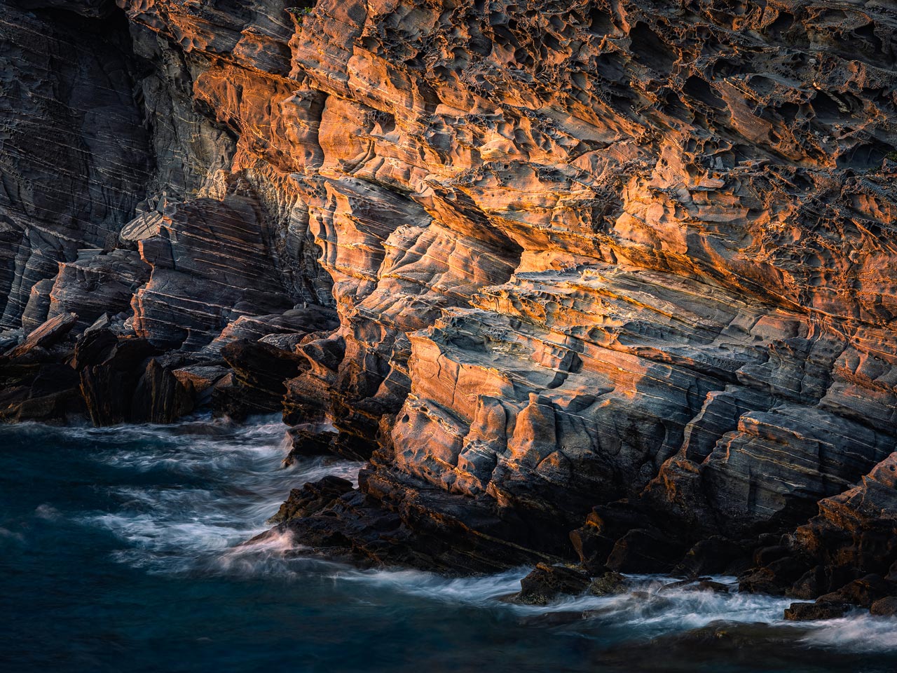 Glowing cliffs at the coast of Paros Park