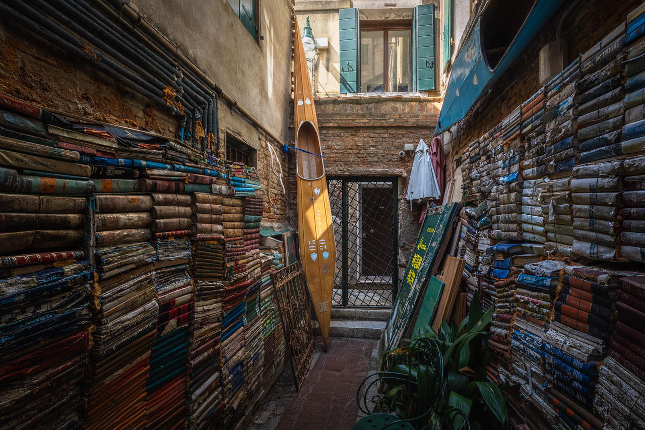 An ancient book shop in Venice with soft light shining in from above