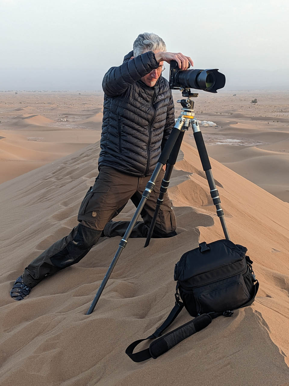 Participant photographing the dunes with a long lens.