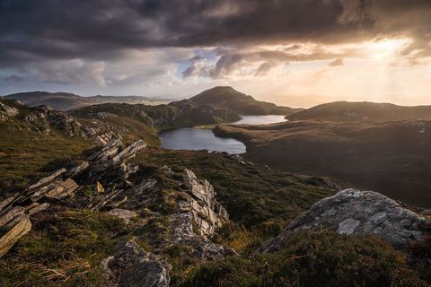 A small mountain ridge in Donegal on a stormy evening in beautiful light.
