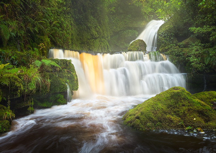 A waterfall within the lush Catlins forest