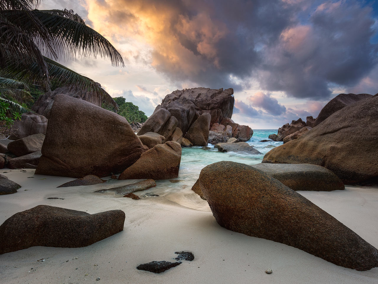 A secluded cove at Anse Patates during Sunset