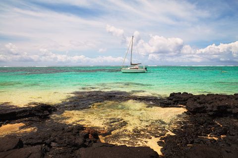 A boat on turquise waters.