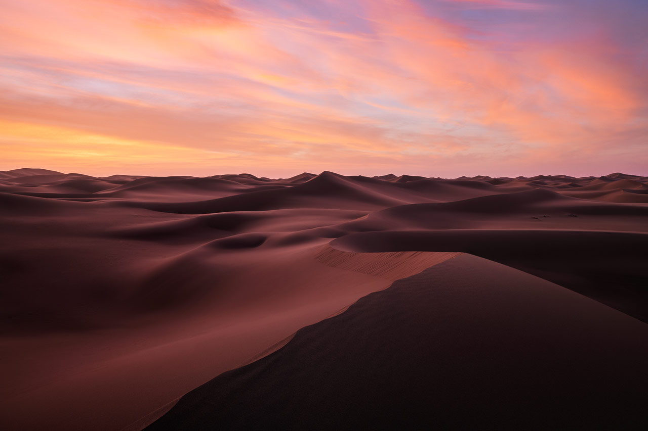 Burning skies above the dunes of the Moroccan Desert.
