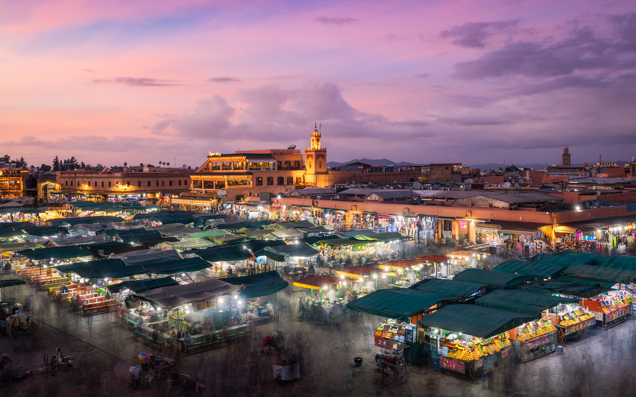 Evening mood at Jemaa El Fna with a beautiful sunset sky above.