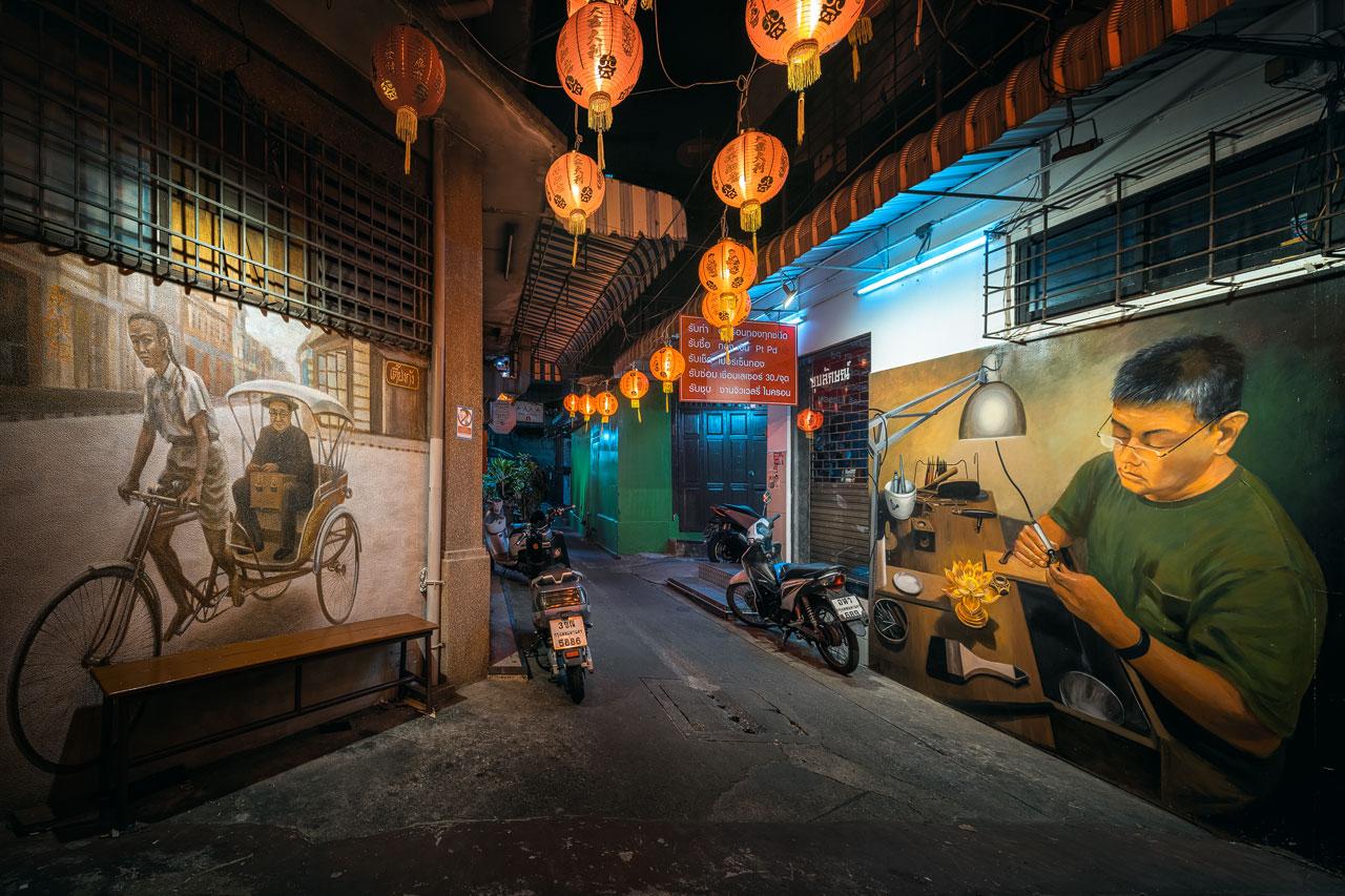 Photo of an alley in China Town Bangkok, which features beautiful street art