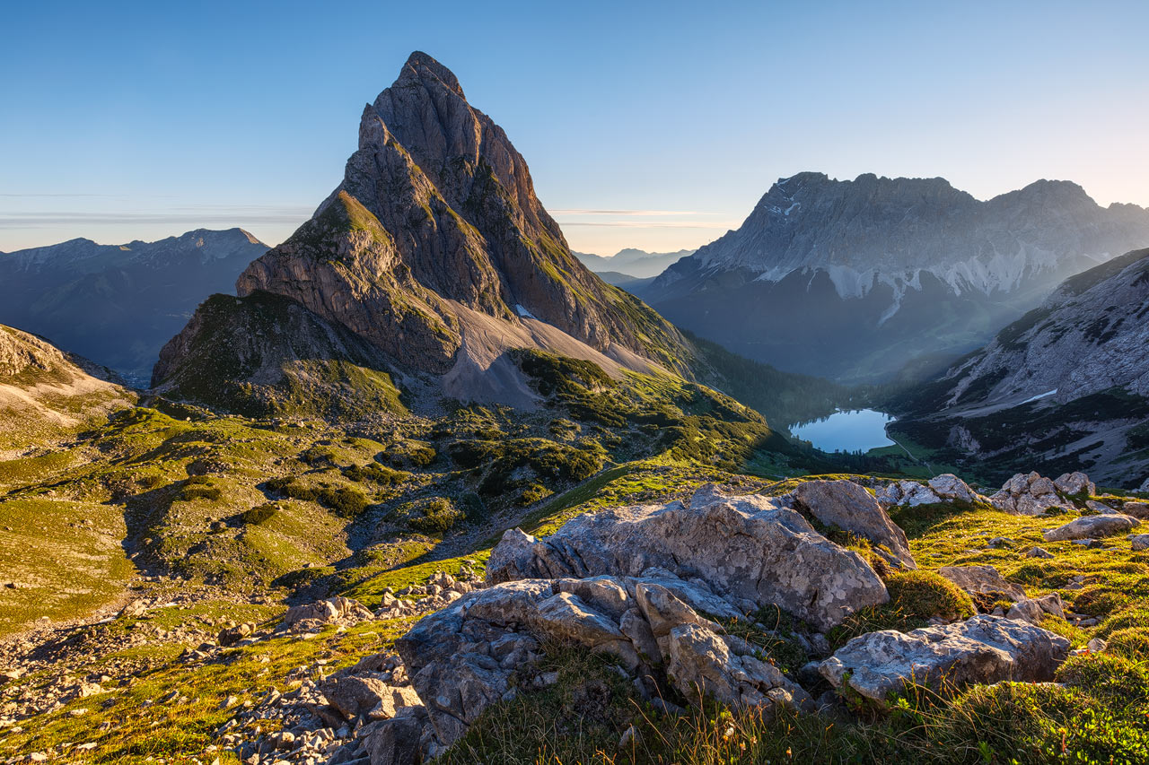 View toward the Sonnenspitze and Zugspitze during sunrise.