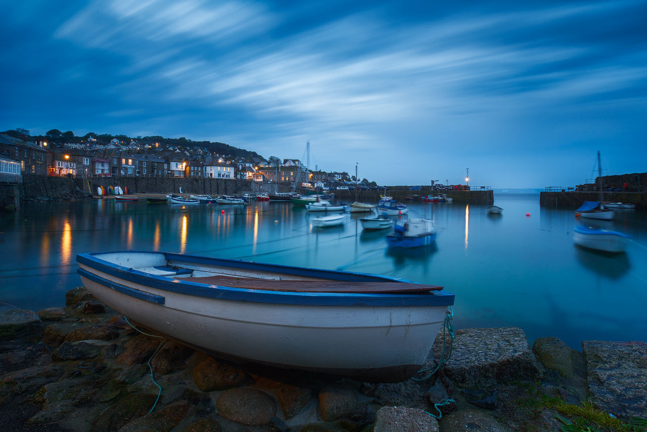 Boats in Mousehole Harbour during Blue Hour.