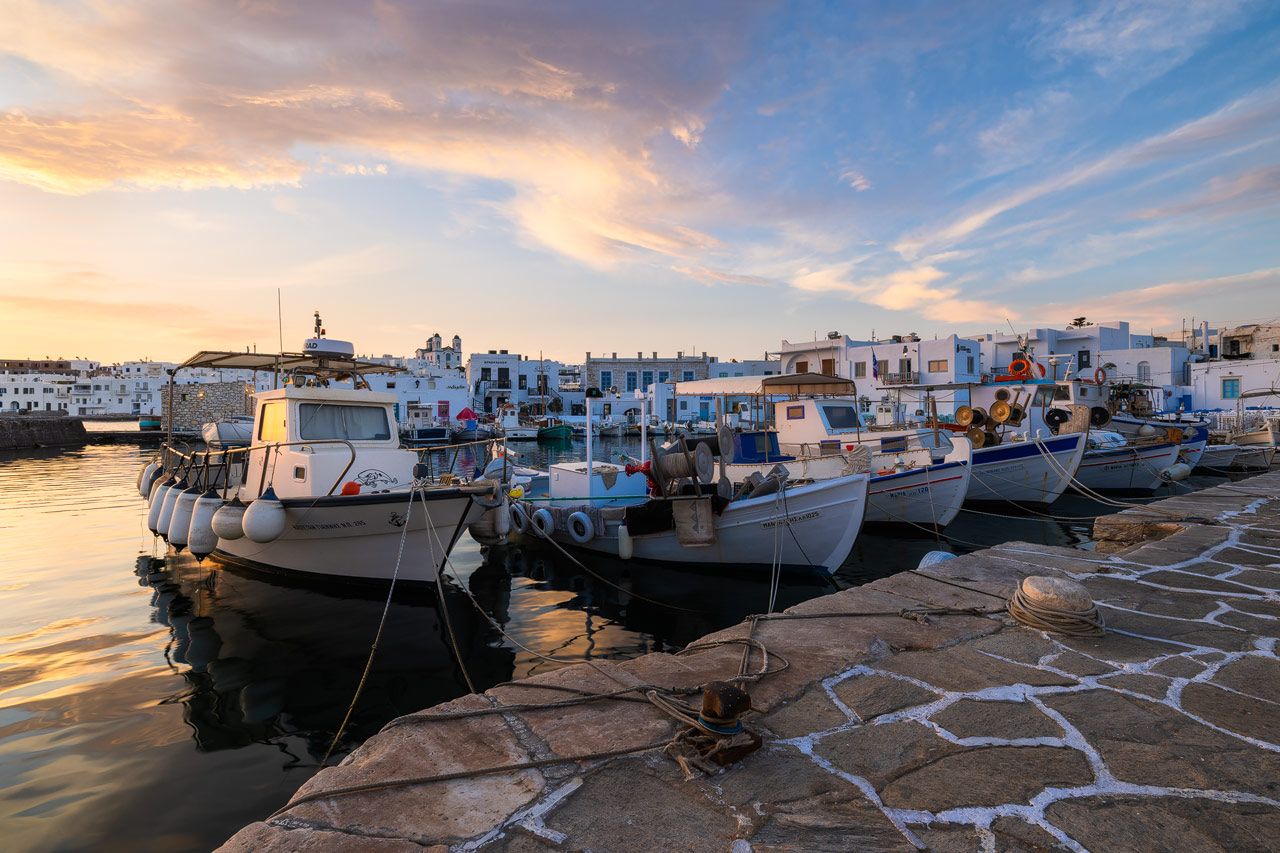 Warm sunrise light over the boats in Naoussa harbour