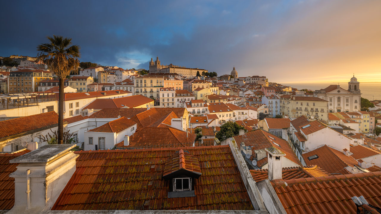 Colorful sunrise over the Alfama district in Lisbon