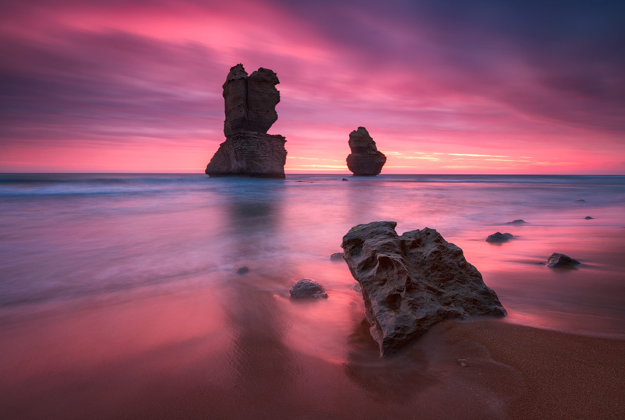 The Gibson Steps at the 12 Apostels coast in Australia with a colorful sunset behind.